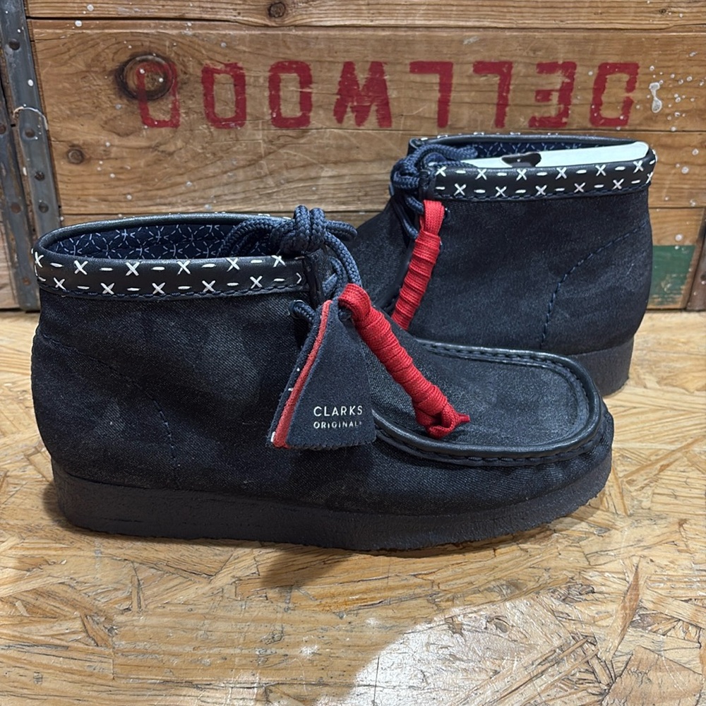Brand new unworn denim discontinued Clark Wallabee. Multiple sizes available.